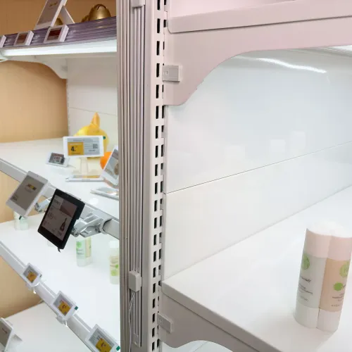 Retail fixture concept showing lighting, conductive power and digital shelf layers designed together